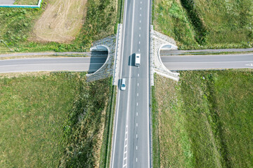 Wall Mural - bridge over highway road. sunny countryside landscape. top view aerial photo.