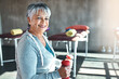 Forever fit, thats my motto. Portrait of a happy senior woman working out with weights.
