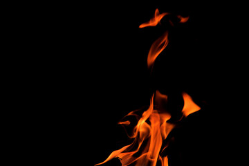 Close up burning flames on black background for graphic design or wallpaper