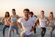 © NDABCREATIVITY - Fitness sport friendship and healthy lifestyle concept. Group of happy friends or people exercising