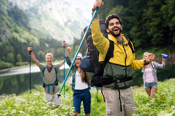 Wall Mural - hiking friends travel outdoor group sport lifestyle concept