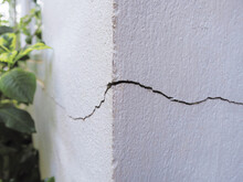 Cracked Concrete Building Wall At The Outside Corner That Effected With Earthquake And Collapsed Ground