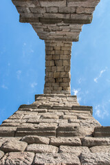 Wall Mural - The famous Roman aqueduct of Segovia in Spain. Heritage of humanity by unesco. stone for the construction of a road