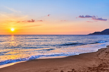  Landscape of scenic idyllic peaceful calm sky wallpaper with sea waves coast and sandy beach at golden sunset