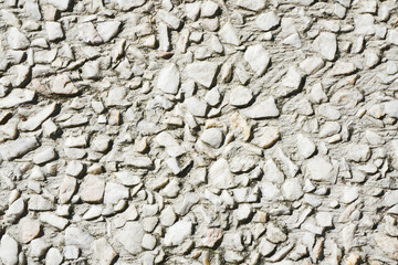 Gravel texture. Small rocks grain pattern for graphic design. Little stones background. Gray noise backdrop. Fence facade texture.