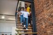 © zinkevych - Boy girl and man going down stairs at home