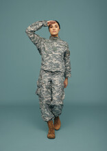Female Army Soldier Saluting In A Studio