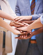 Not I, but we. Cropped shot of a group of coworkers with their hands in a huddle.