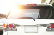 © vach - Rear aspect or back view of SUV car in day time real road