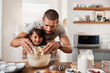 © Chanelle Malambo/peopleimages.com - Baking brings out the artist in us all. Cropped shot of a young man baking at home with his young daughter.