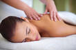 © Thurstan Hinrichsen/peopleimages.com - Letting her worries drift away. Shot of a young woman enjoying a back massage at a spa.