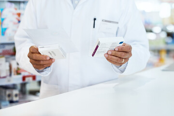 Poster - This is going home with you. Closeup shot of an unrecognizable pharmacist holding prescription medication in a chemist.