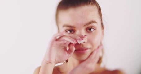 Wall Mural - Beautiful girl isolated in studio, white cream application, selective focus, shallow dof