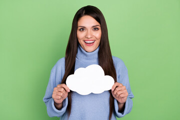 Poster - Photo of impressed mature brunette lady hold cloud wear blue turtleneck isolated on green color background