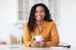 © Prostock-studio - Portrait of happy pretty black woman enjoying morning coffee