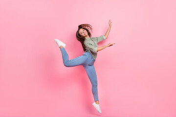 Wall Mural - Full length photo of sweet millennial brunette lady jump wear outfit jeans sneakers isolated on pink color background