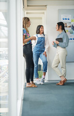 Poster - Catching up while making big plans. Shot of a group of businesswomen having a discussion in an office.