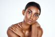 Skin care is the first step of self care. Studio shot of a beautiful young woman posing against a light background.