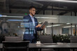 © Prostock-studio - Positive middle eastern manager using digital tablet at office