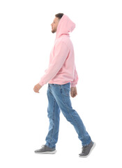 Wall Mural - Young guy in stylish hoodie on white background