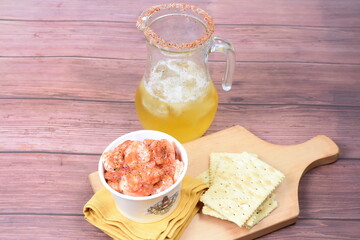 Wall Mural - Peruvian ceviche, accompanied by soda crackers, pepper and lemon