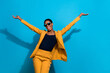 Photo of funky cool person raise hands have good mood enjoy disco isolated on blue color background