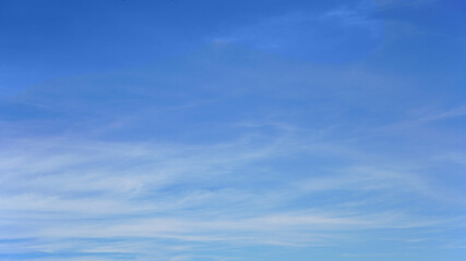Wall Mural - white clouds and blue sky suitable for background or sky replacement.