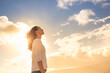 © kieferpix - Letting go of life problems and finding peace. Happy woman looking up to the sky feeling energized, inspired.