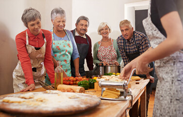 Sticker - Youre never too old to learn. Shot of a group of seniors attending a cooking class.