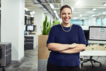 Wall Mural - Confidence is a key feature for achieving success. Portrait of a young designer standing in an office.