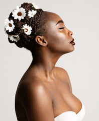 Wall Mural - beauty profile of african american woman with white chamomile flowers in black hair braids. fashion 
