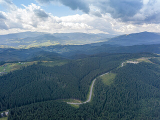  Green mountains of Ukrainian Carpathians in summer. Sunny day. Aerial drone view.
