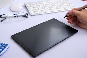 Sticker - Hands holding a tablet computer with an isolated screen and a business desk with a PC, wireless mouse, and keyboard business-related items