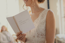 Woman Reading A Wedding Programme