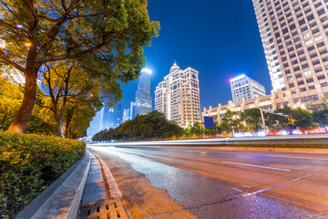 Wall Mural - moving car with blur light through city at night