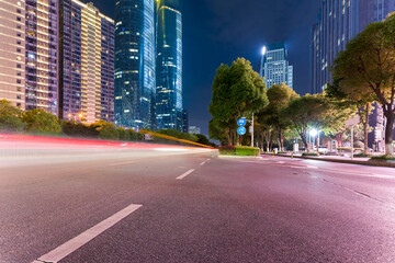 Wall Mural - the light trails on the modern building background in shanghai china