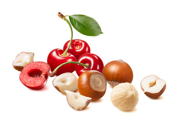 Wall Mural - red sweet cherries and hazelnuts isolated on white background. whole nuts and broken pieces.