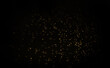 © Aekkapob - Abstract golden bokeh on black background Christmas party day