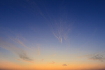 Wall Mural - beautiful vivid sky painted by the sun leaving bright golden shades.dense clouds in twilight sky in 