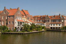 Historic Canal Houses On The Old Harbor Of The Picturesque Town Of Enkhuizen In West Friesland.