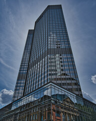 Wall Mural - Beautiful shot of a cityscape under the cloudy skies during the day