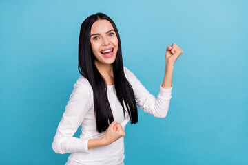Wall Mural - Photo of impressed young brunette lady yell wear white shirt isolated on blue color background