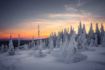 Vibrant sunset scene over Dreisesselberg in winter, on the border of Germany and the Czech Republic