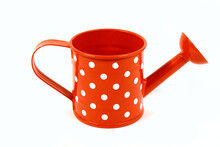 Close-up Shot Of A Red Polka Dot Watering Can Isolated On A White Background