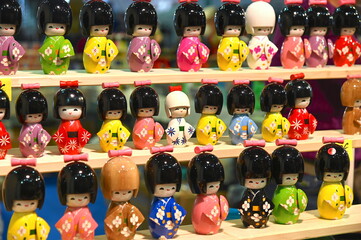 Wall Mural - collection of Japanese dolls inspired by the tradition of mini kokeshi dolls narrow focus field