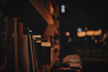 Wall Mural - closeup of a library on a dark background