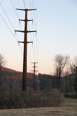 Sticker - Vertical shot of power lines over mountain