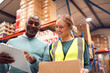 © Monkey Business - Male Team Leader With Clipboard In Warehouse Training Intern Standing By Shelves