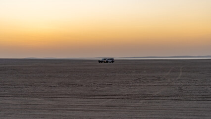 Wall Mural - People driving 4x4 vehicle on the dunes in sealine.