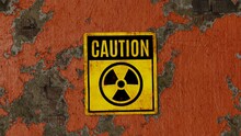 Radioactivity Sign - Caution, On An Orange Painted Peeling Brick Wall
